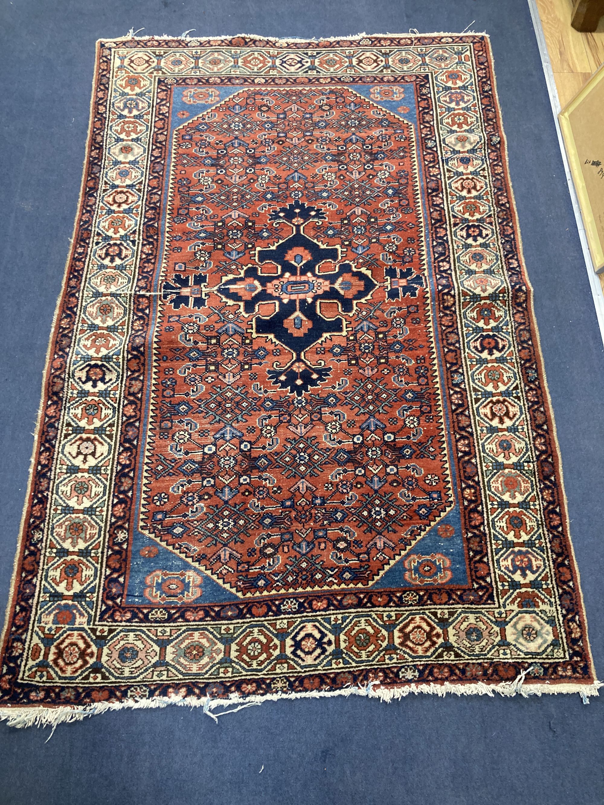 A Caucasian Hamadan red ground rug, 220 x 136cm